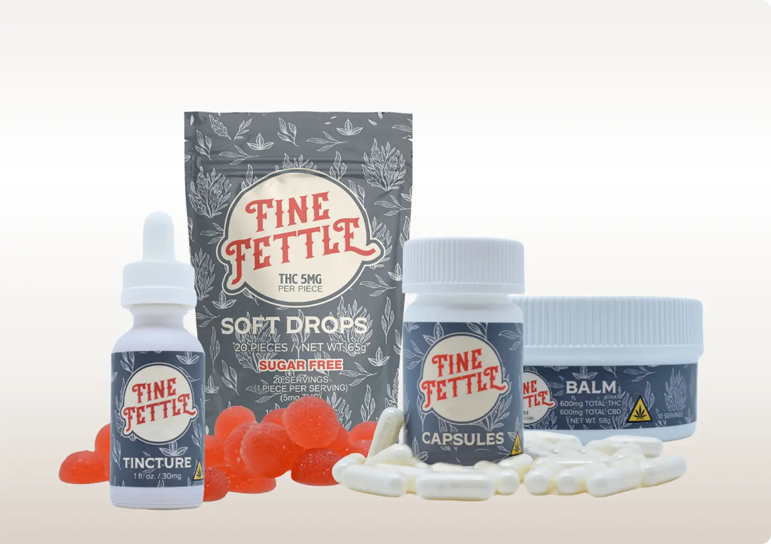 A selection of Fine Fettle products, including tincture, soft drops, capsules, and balm, displayed with white and red capsules and gummies.