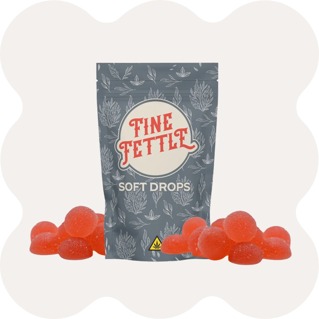 A gray bag labeled Fine Fettle Soft Drops stands surrounded by red, sugar-coated gummy candies.