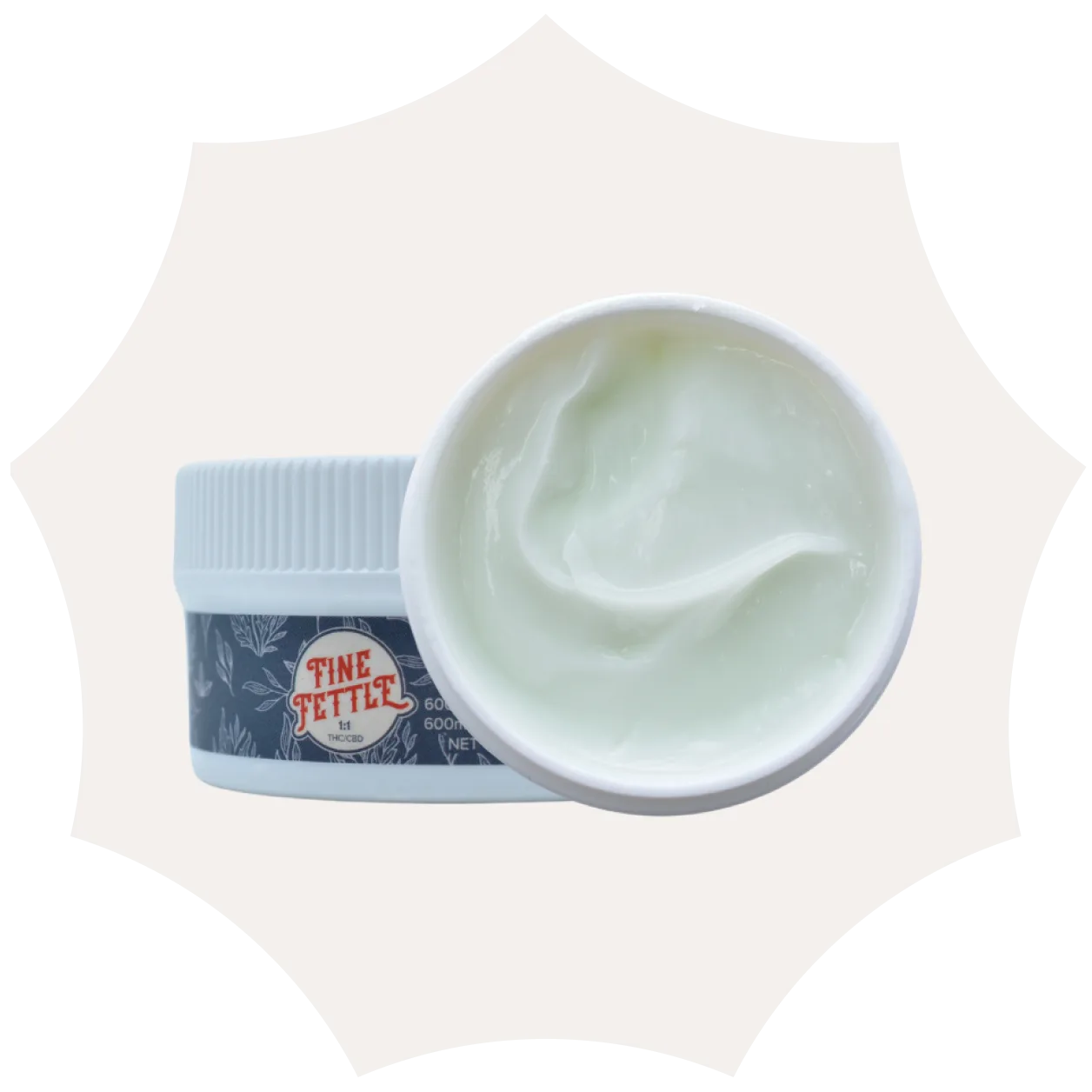 A white container labeled Fine Fettle with its lid off, showing light green cream inside. The container is set against a pale, star-shaped background.